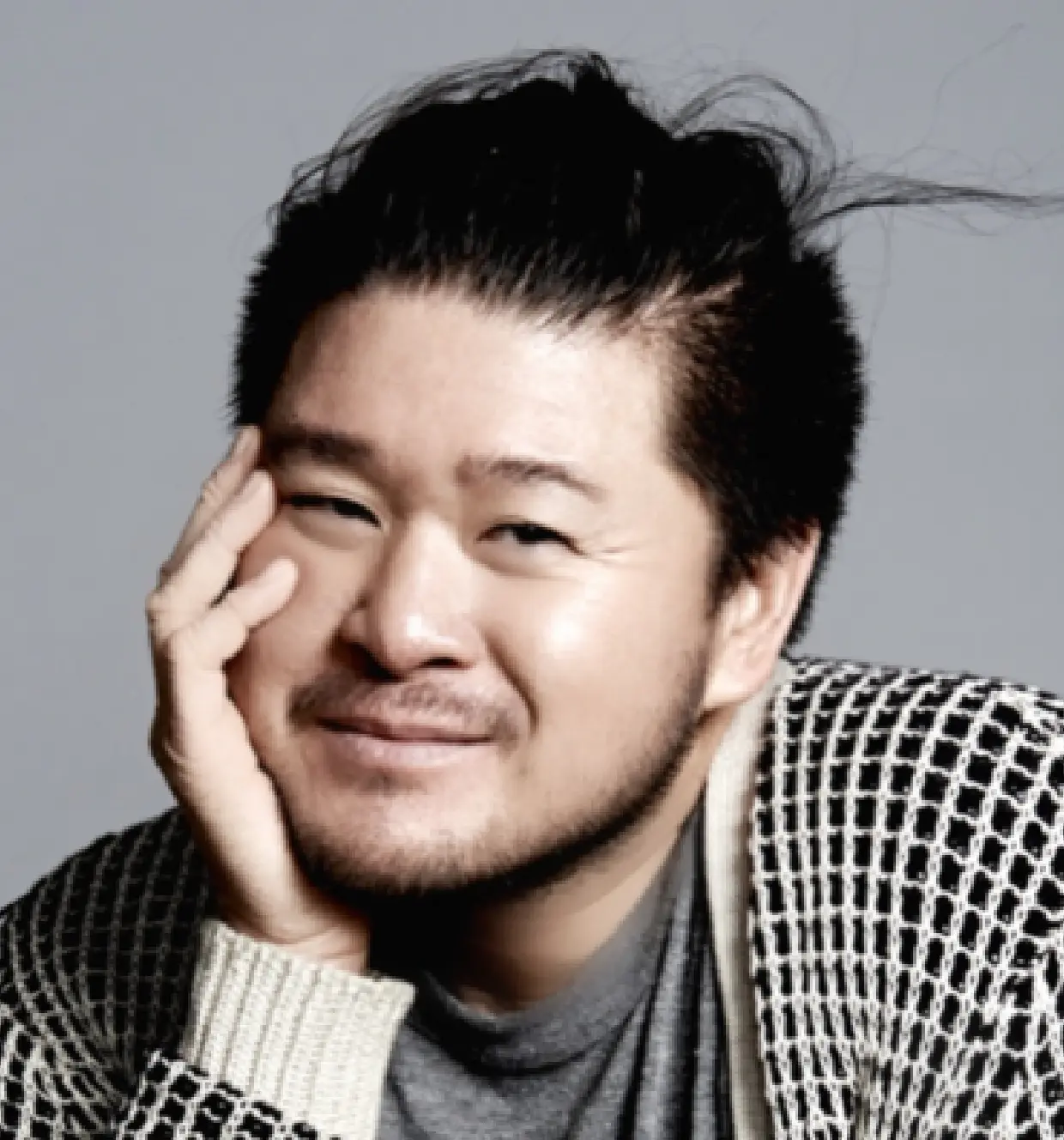 Allan Avendaño, a man in his 30s, is looking at the camera with a soft smile.