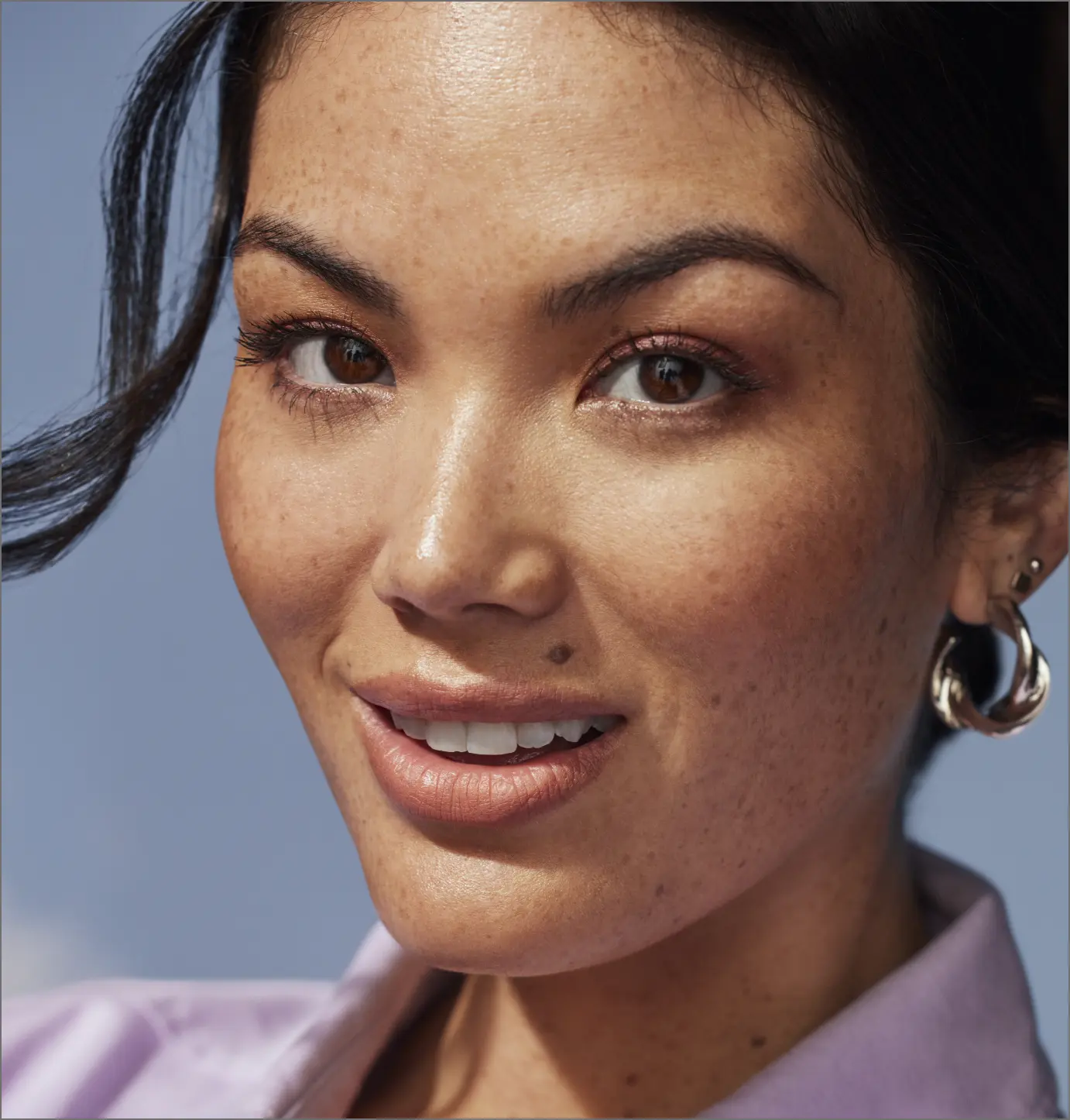 Smiling woamn wearing earrings