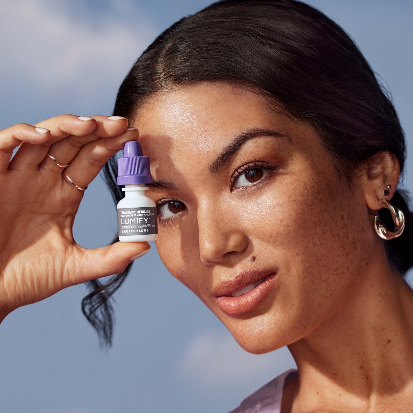 Bottle of Lumify redness reliever eye drops next to its box